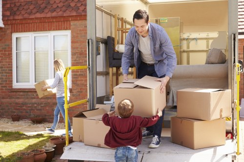 Packed moving boxes and furniture loaded into a removal truck
