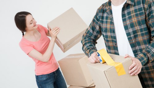 Professional movers following safe working practices during a job