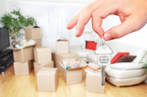 Careful loading of household items into a van for West Hampstead relocation