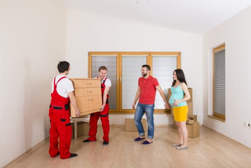 Flat-to-flat removals service showing stair access and furniture handling in West Hampstead
