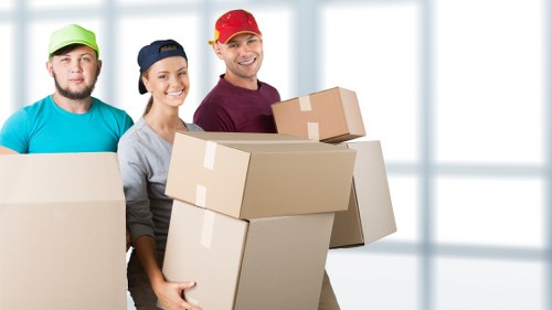 Packed business furniture ready for relocation in a local area