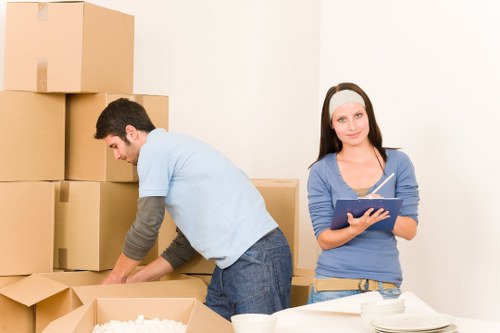 Packed boxes and furniture ready for flat removals