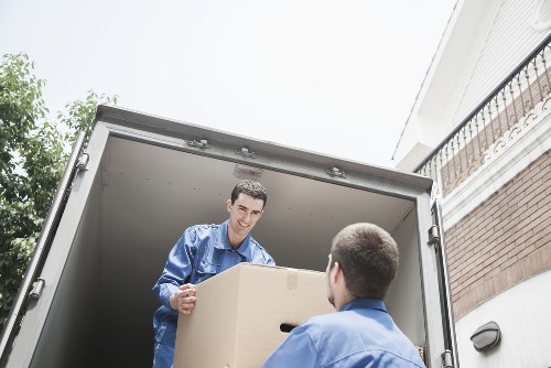 Moving crew handling furniture with care during delivery