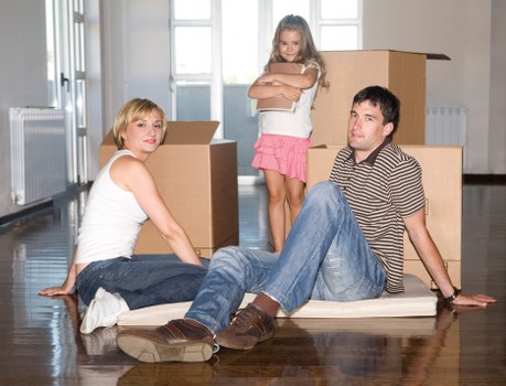 Boxes and household items prepared for a local move in NW6